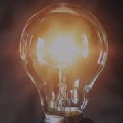 A light bulb in front of a dark background