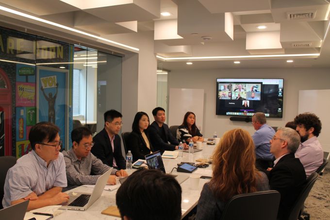 Page Center scholars in a conference room at Brownstein Group's offices in Philadelphia presenting research on digital analytics.