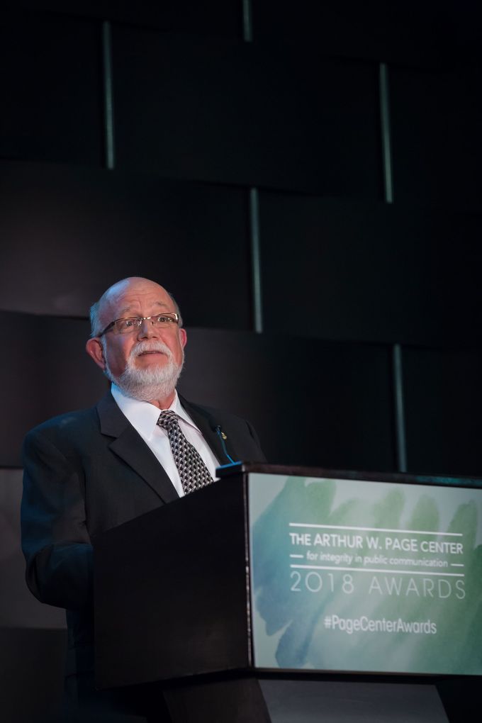 Advisory board member Tom Martin introduces honoree John Onoda.