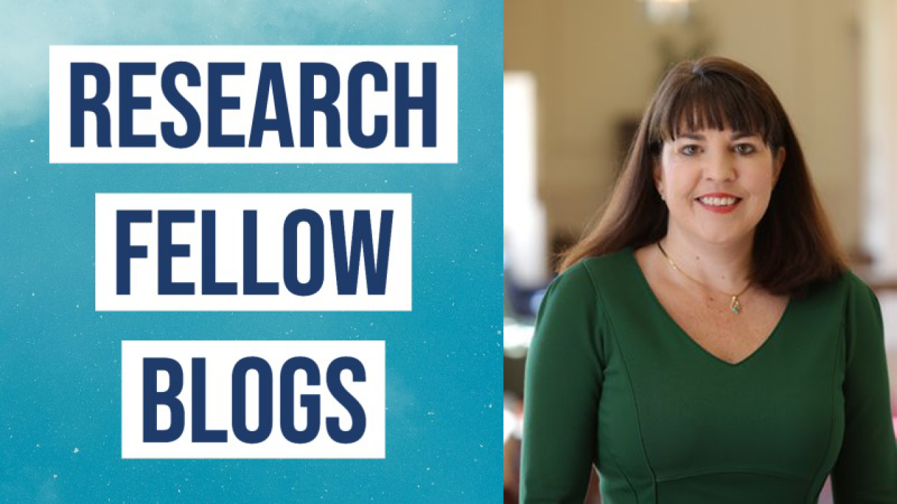 Image of a women with long brown hair wearing a green v-neck sweater next to the text Research Fellow Blogs